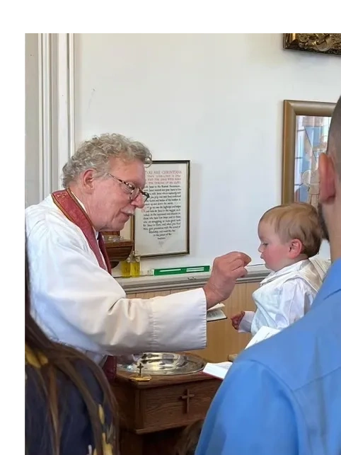 Fr. Jonathan Ostman with a parishioner
